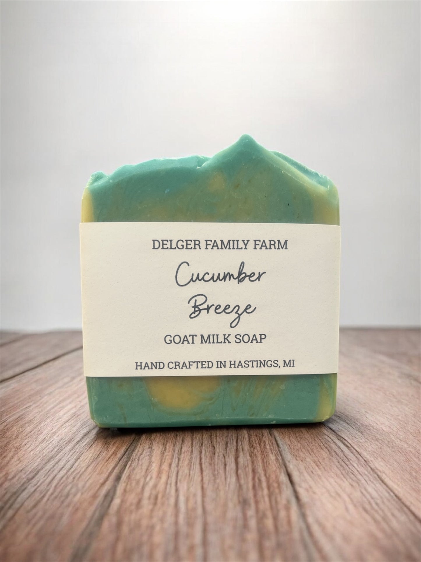 Goat milk soap bar with a label on a wooden surface