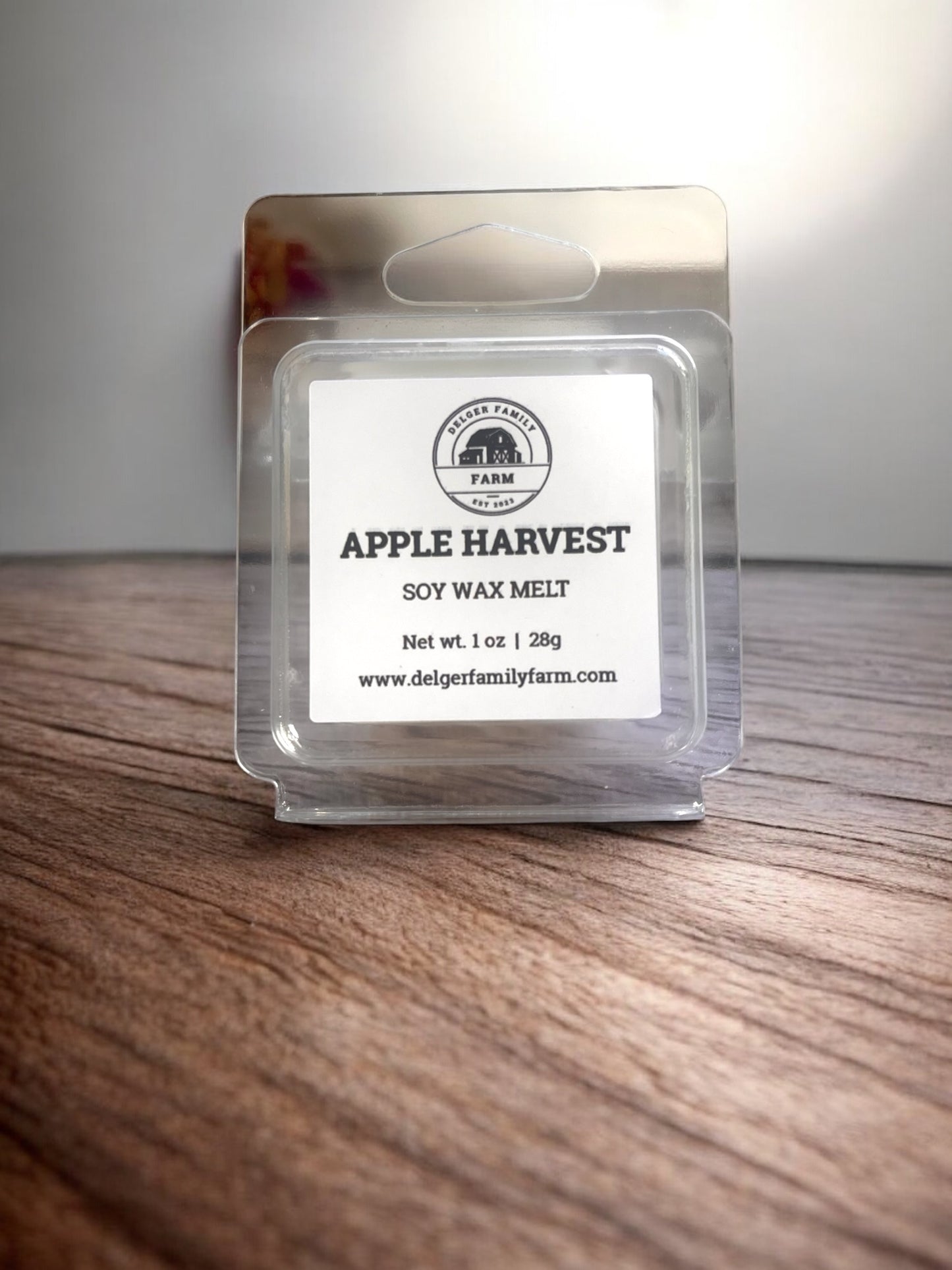 Apple Harvest soy wax melt packaging on a wooden surface