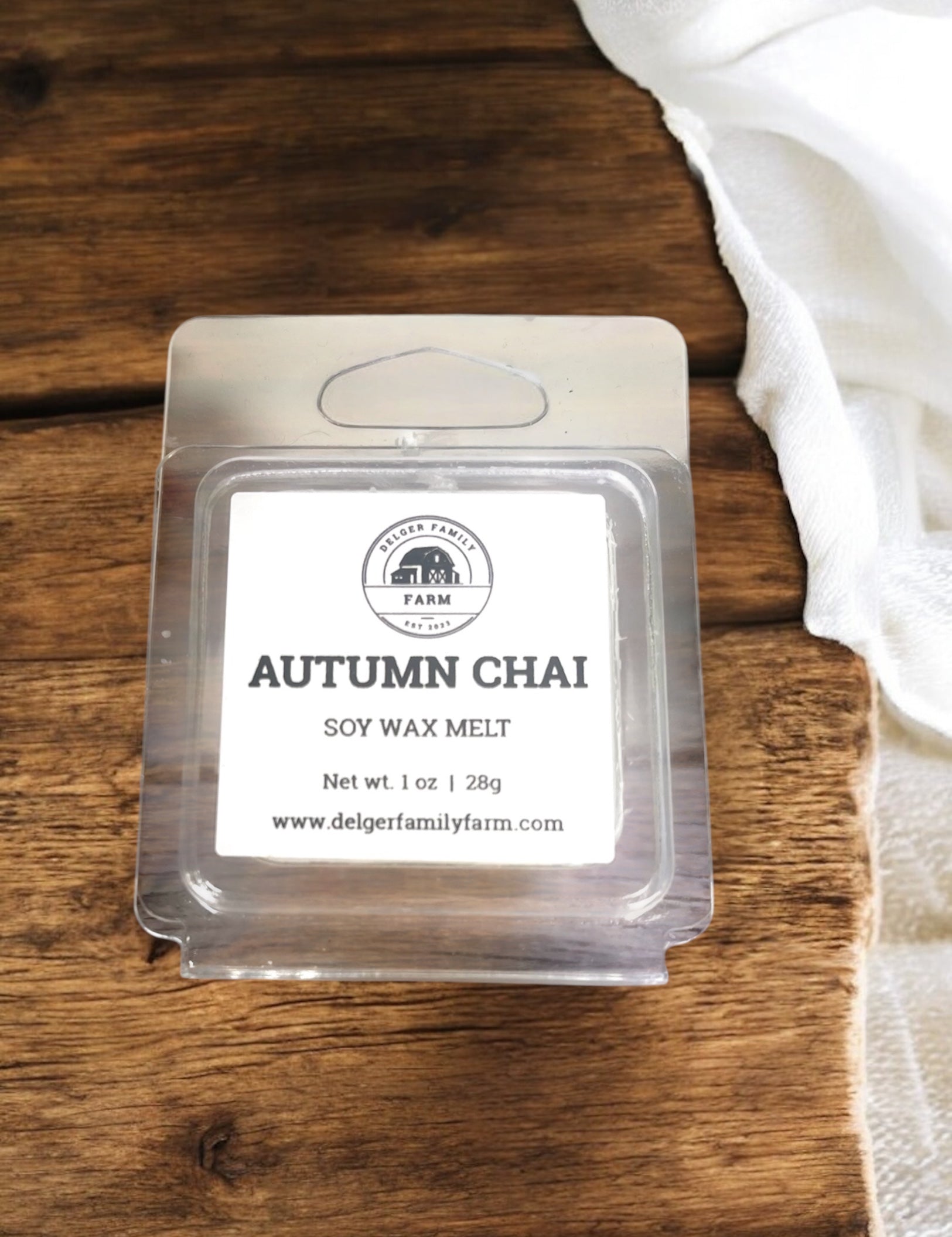 Autumn Chai soy wax melt packaging on a wooden surface