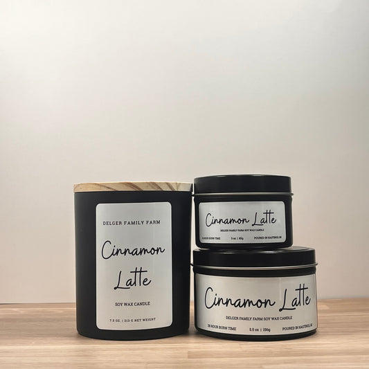 Cinnamon Latte candles by Delger Family Farm on a wooden surface with a neutral background