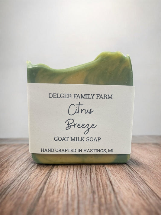 Green and white soap bar with 'Delger Family Farm' label on a wooden surface