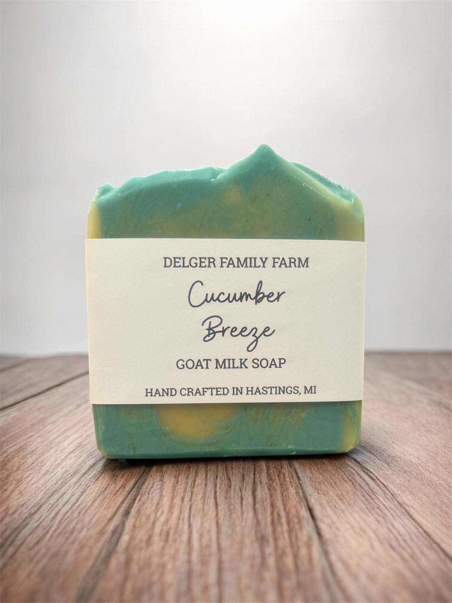Goat milk soap bar with a label on a wooden surface