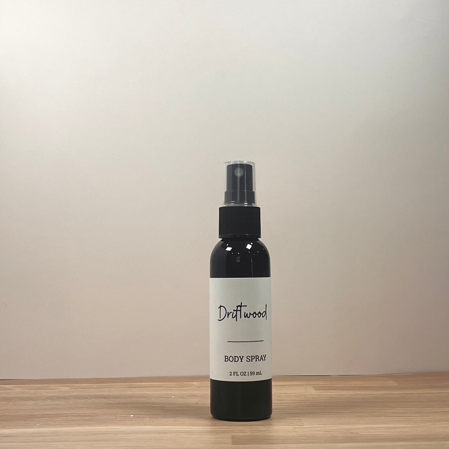 Black bottle on wooden surface