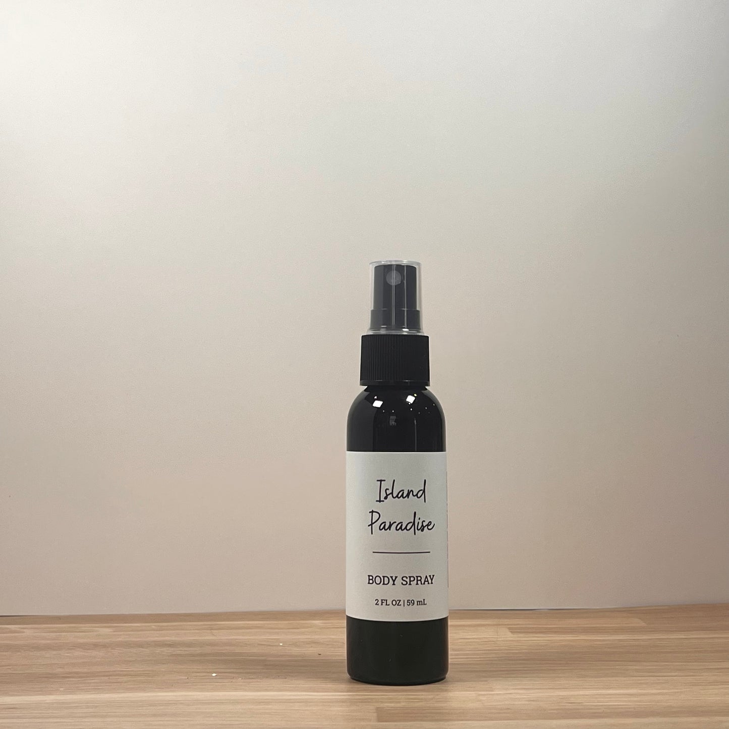 Black bottle on wooden surface