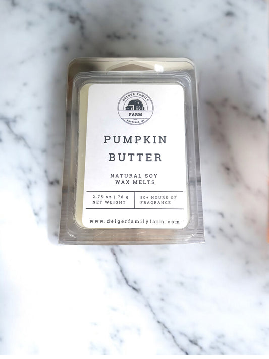 Pumpkin Butter wax melt package on a marble surface