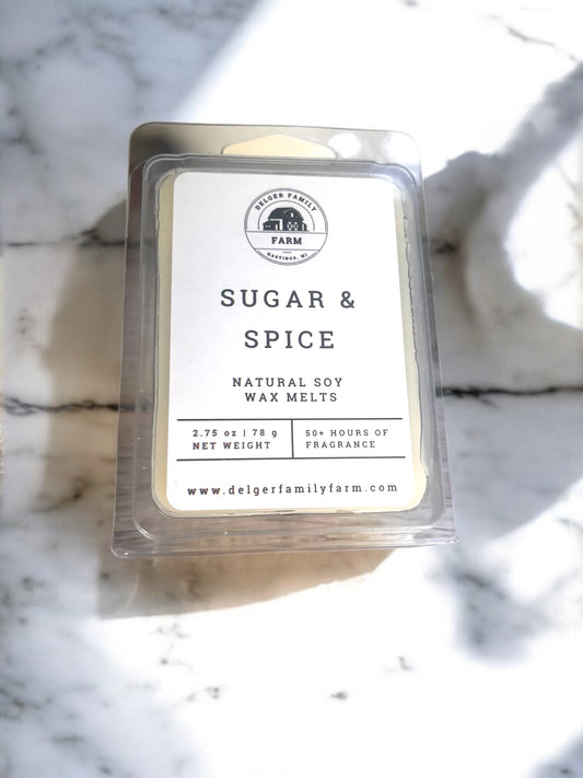 Pack of sugar and spice wax melts on a marble surface