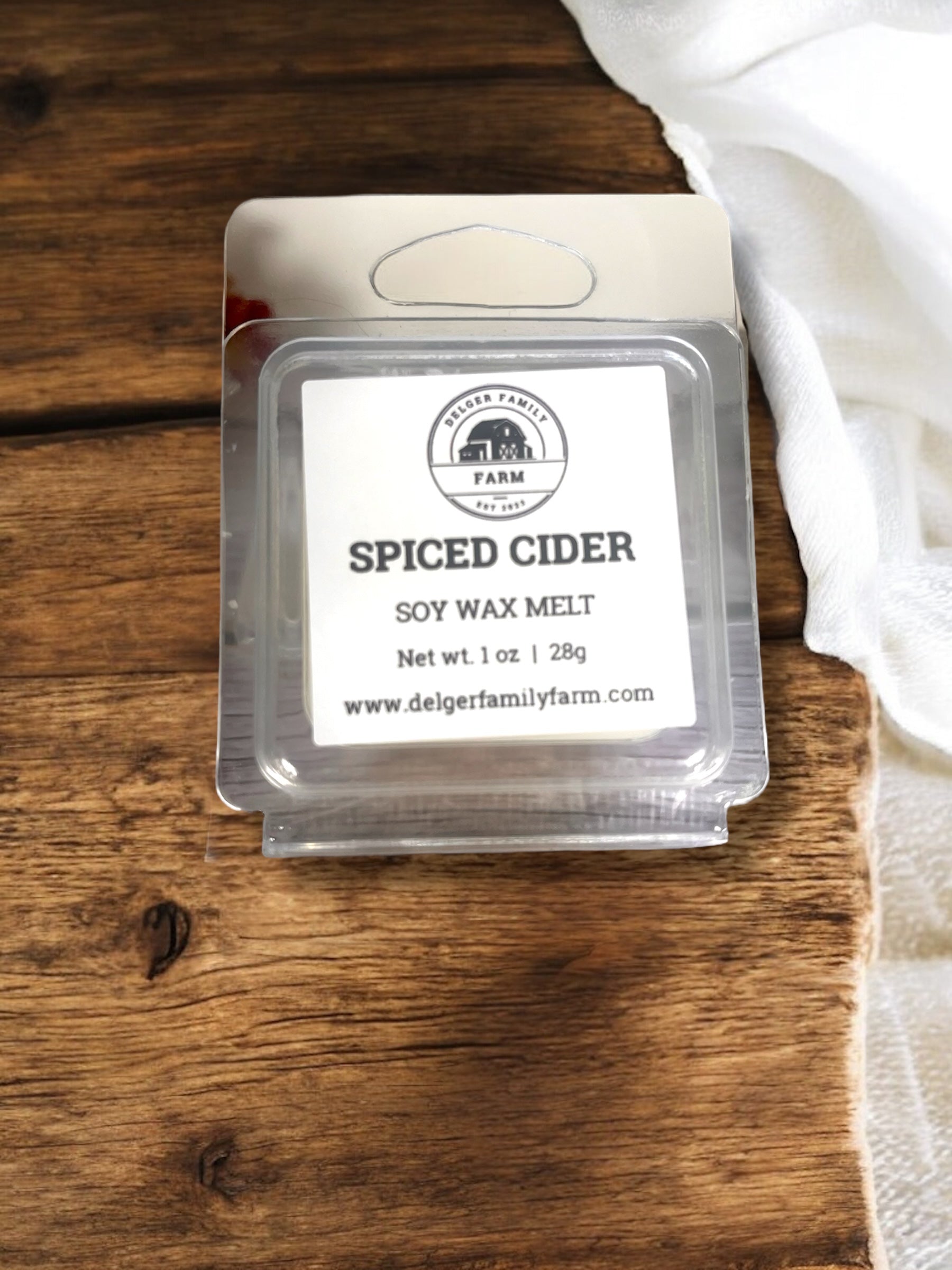 Spiced Cider soy wax melt packaging on a wooden surface