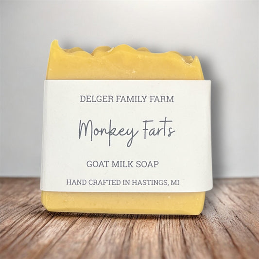 Bar of soap with a label on a wooden surface