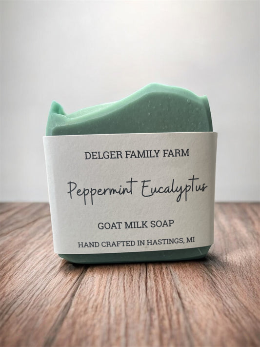Goat milk soap with a label on a wooden surface
