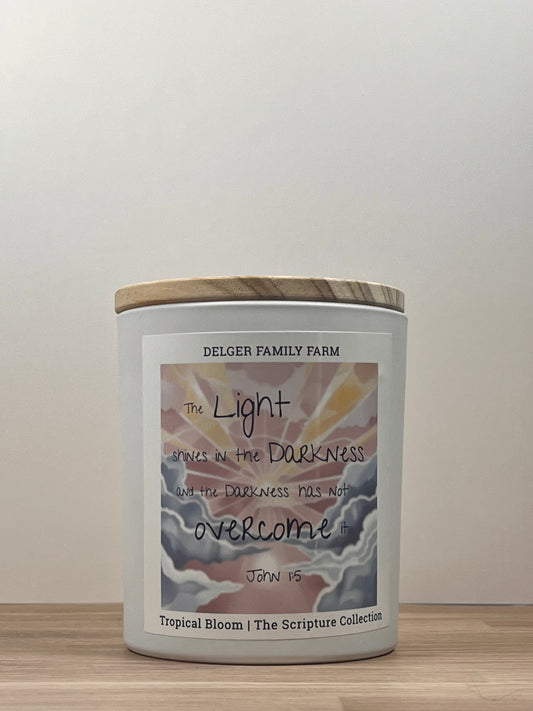 White candle sitting on wood 